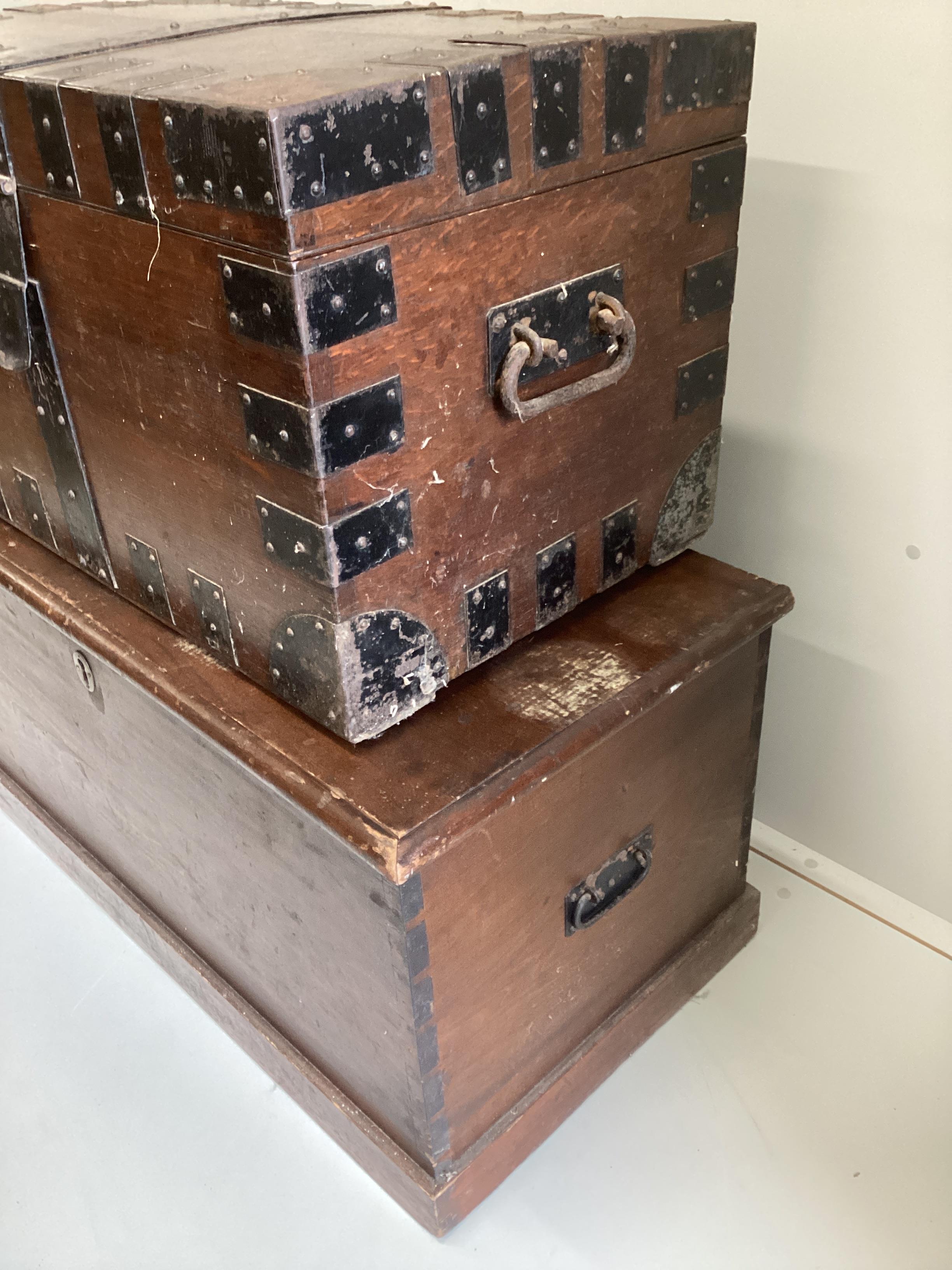 A Victorian iron bound oak silver chest, width 75cm, depth 47cm, height 46cm together with a larger Victorian stained pine trunk